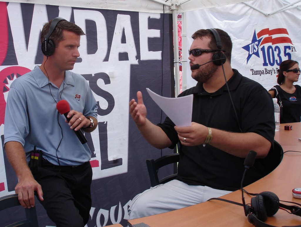 Bucs general manager Mark Dominik listens to Justin Pawlowski make a point during a broadcast of "The Blitz."