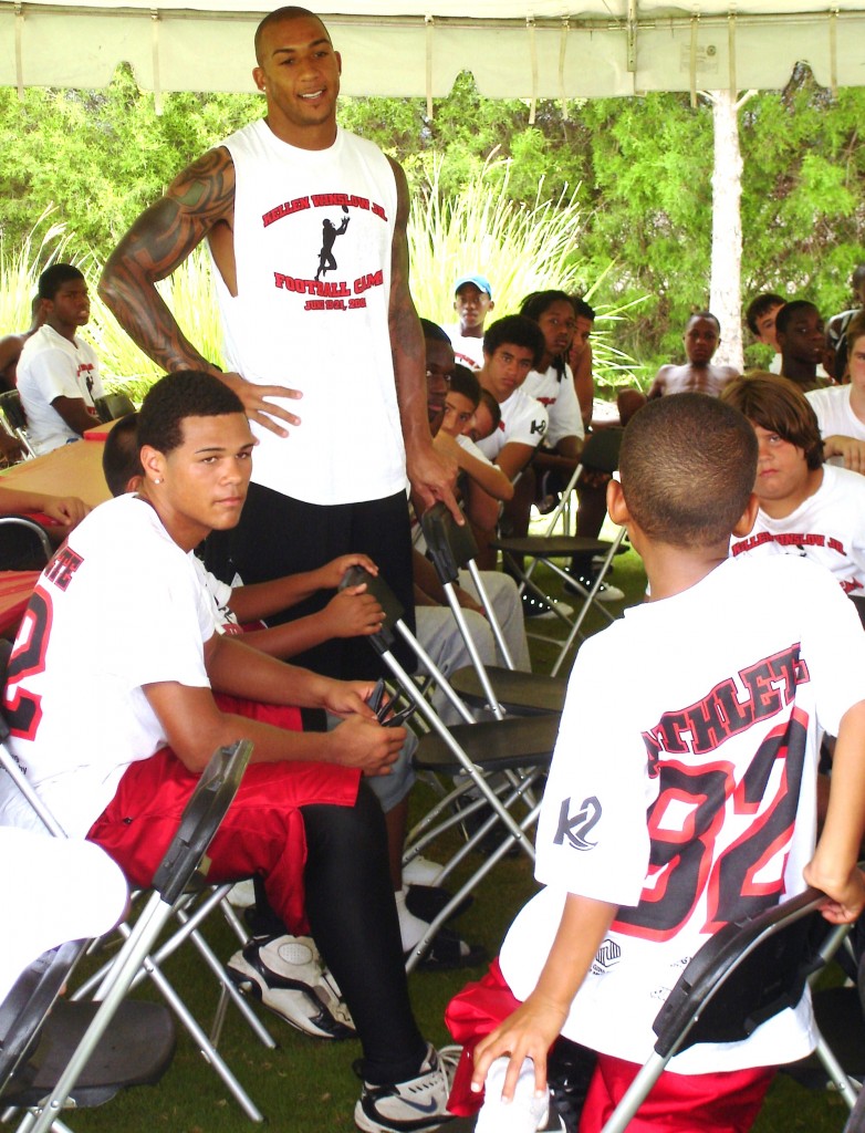 Winslow listens to a youngster's question during a break in Sunday's activities.