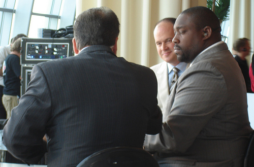 Steve Mariucci talks to fellow NFL Network analysts Warren Sapp and Rich Eisen live during media day at Joe Robbie Stadium.  