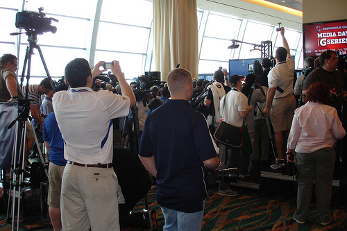 The army of reporters, photographers and cameramen of all sorts surrounding Colts quarterback Peyton Manning. Joe never saw him once during the Colts session due to the mob scene around him.