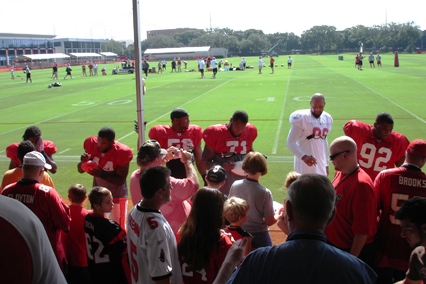 Bucs players come over to the stands to mingle and sign autographs for the fans just prior to the first day of training camp.