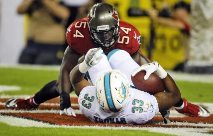 Lavonte David buries Dolphins running back Daniel Thomas Monday night. David and the Bucs set a team record for fewest rushing yards allowed in a game, two.
