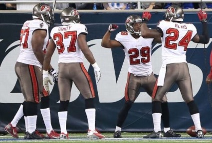 Bucs teammates celebrate with Leonard Johnson after his pick-six and move called "The Clearwater Somersault."