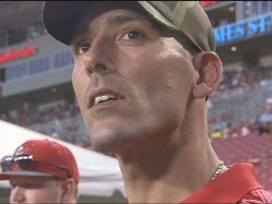 Former Marine Josh Frey, who gave the Bucs one of his two Purple Heart medals, watches the Bucs night practice last week