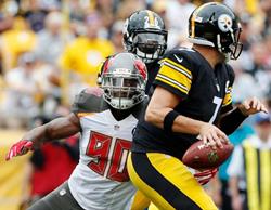 Bucs DE Michael Johnson chases down Steelers QB Ben Roethlisberger for one of his two sacks today. Photo courtesy of Buccaneers.com.