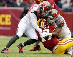 Jacquies Smith (56) and Michael Johnson (90) bring Robert Griffin III down Sunday. (Photo courtesy of Buccaneers.com)
