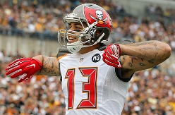 Bucs WR Mike Evans, a former high school basketball star, still has the moves on the hardwood.