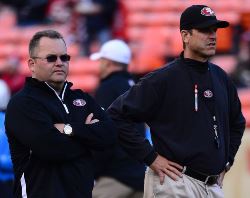 The San Francisco Chronicle hints Jim Harbaugh was run from the 49ers because he wouldn't can his offensive coordinator, Greg Roman.