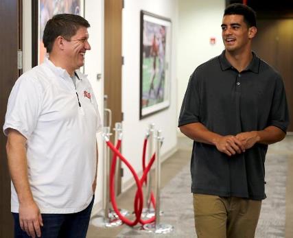 Bucs general manager Jason Licht and Oregon quarterback Marcus Mariota share a laugh during Marota's visit to One Buc Palace today. Photo courtesy of Buccaneers.com.