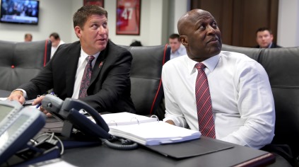 Bucs general manager Jason Licht and coach Lovie Smith watch the NFL Network as Bucs history is being made tonight from the War Room at One Buc Palace. Photo courtesy of Tampa Bay Buccaneers.
