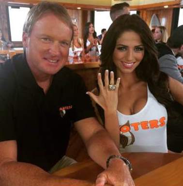 Miss Hooters International 2015 Meagan Pastorchik flashes Chucky's Super Bowl bling during a break in a Hooters commercial shoot this week.