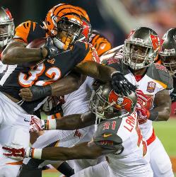 Bucs LB Danny Lansanah, making a tackle on Bengals RB Jeremy Hill last night, admitted tongue-lashings from the Bucs coaches inspired the team to win. Photo courtesy of Buccaneers.com.