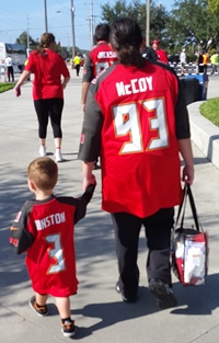 A mom and her little boy walk up to the Den of Depression for Sunday's game against Atlanta.