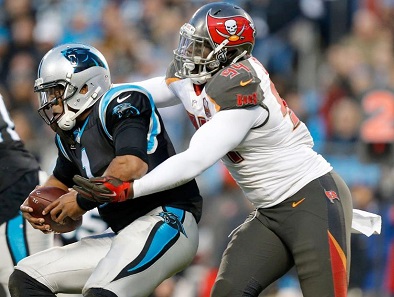 Cam Newton slithered away from what would have been George Johnson's first sack of the season. The Bucs were clobbered in all phases. (Photo courtesy of Tampa Bay Buccaneers)