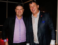 Bucs director of player personnel Jon Robinson, left, with Jason Licht after one of Licht's pool-plunging victory celebrations. (Photo courtesy of Buccaneers.com.)