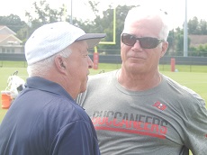 Bucs defensive coordinator Mike Smith chats with Hall of Fame voter Ira Kaufman after a recent practice.