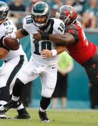 Clinton McDonald wraps up Sam Bradford. (Photo courtesy of Buccaneers.com)