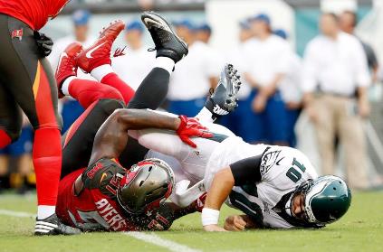 Bucs DE Robert Ayers puts Eagles quarterback Chase Daniel on the turf. (Photo courtesy of Buccaneers.com)