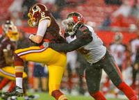 Bucs DE Jacquies Smith tackles Redskins QB Nate Sudfeld for Smith's fourth sack this preseason. (Photo courtesy of Buccaneers.com.)