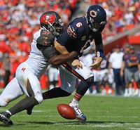 DE Robert Ayers harasses bratty Jay Cutler.