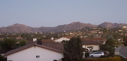 A view outside Joe's suburban San Diego hotel last night as the sun bounces off the mountains at dusk before sinking into the Pacific Ocean.